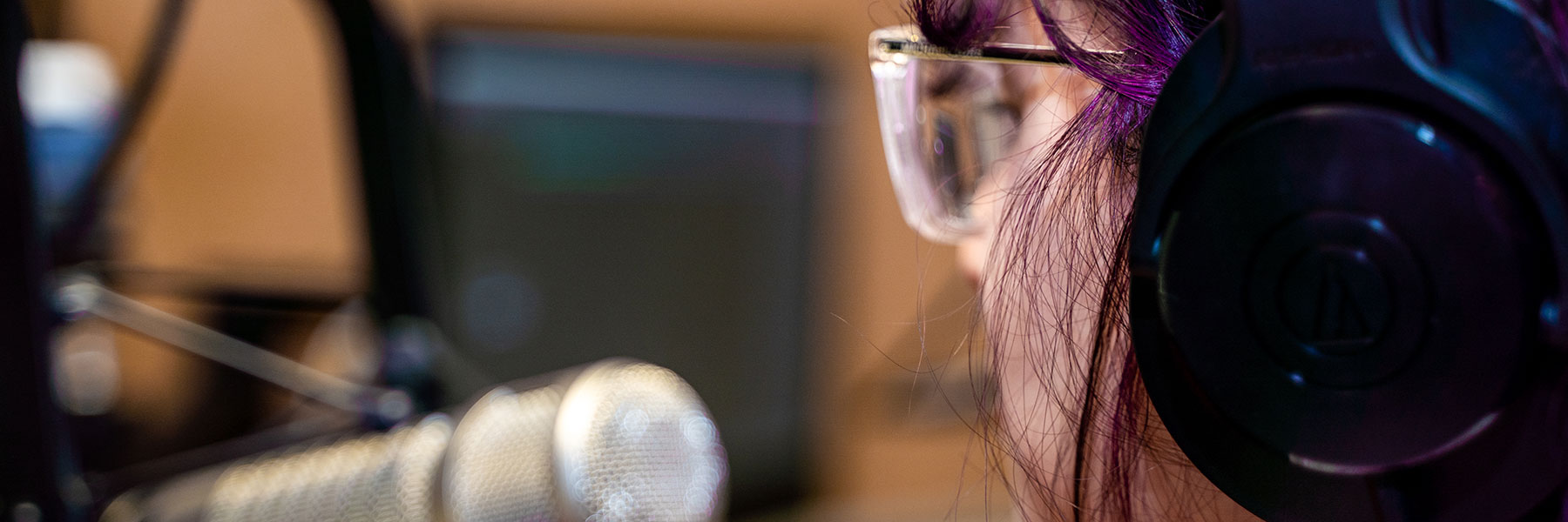 closeup of student talking into a microphone